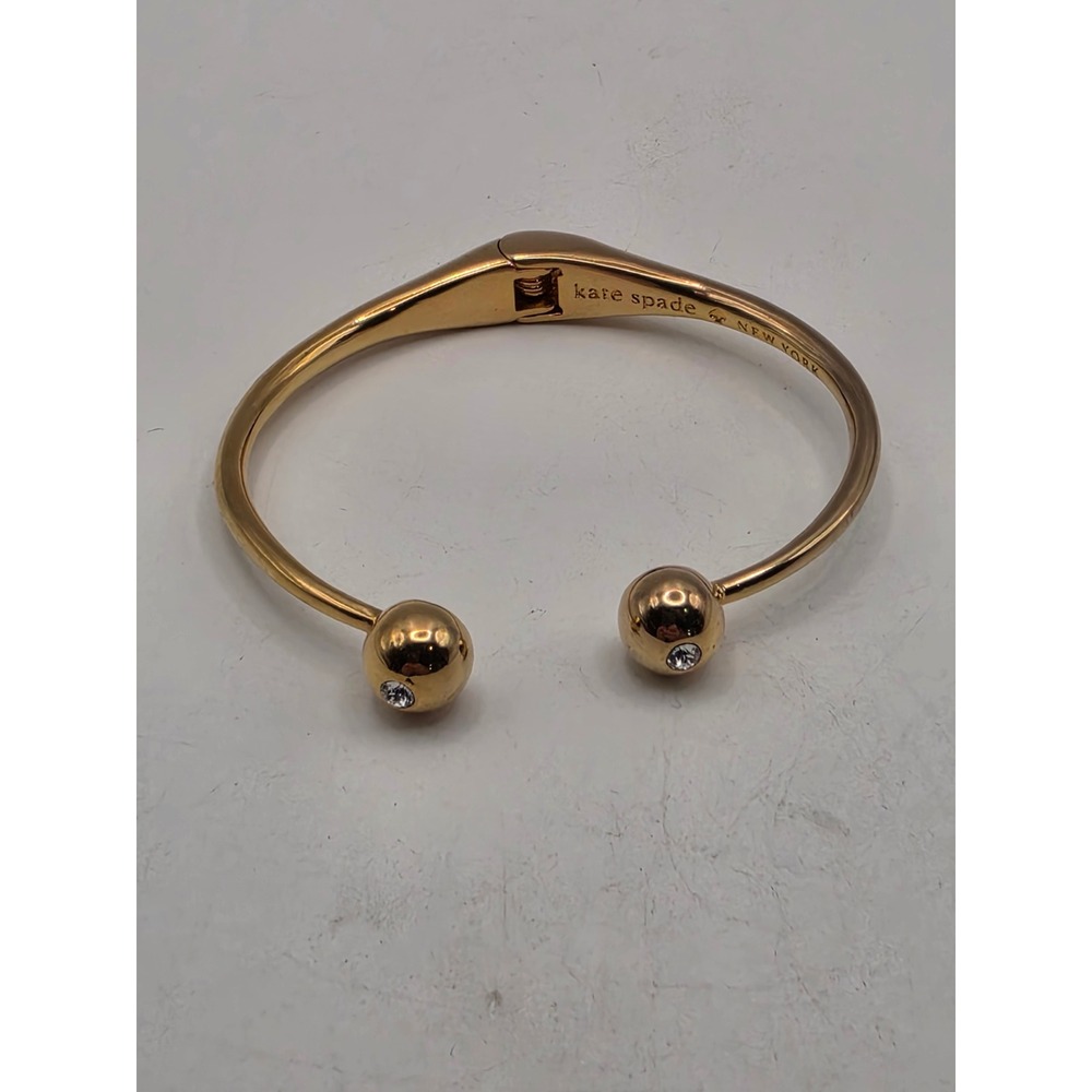 Kate Spade New York Gold Tone Hinged Cuff Bracelet with Crystal Sphere Accents